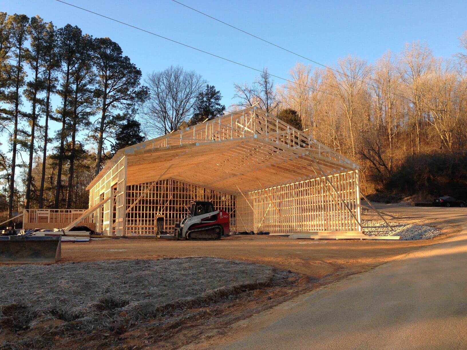Photo of barn with wood trusses