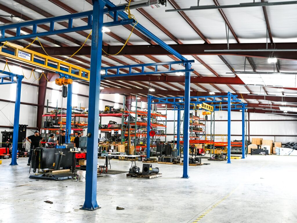 A mechanic shop inside of a steel frame building