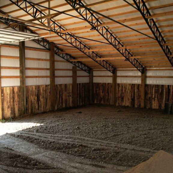 dji_fly_20230818_151500_413_1692389985009_photo Inside of post frame building with steel trusses